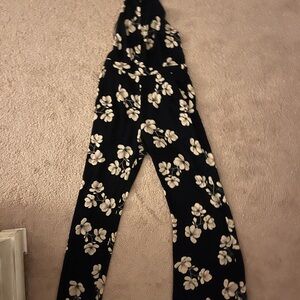 Jumpsuit. High neck low cut back mid back.  Flowy pants.  Lined